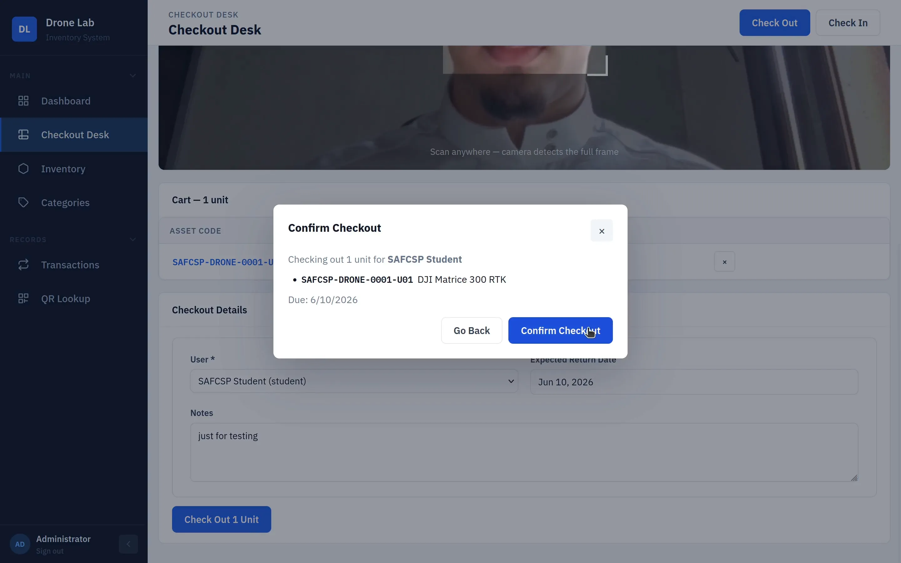 Confirm checkout modal showing the unit, borrower, and due date before completing the transaction