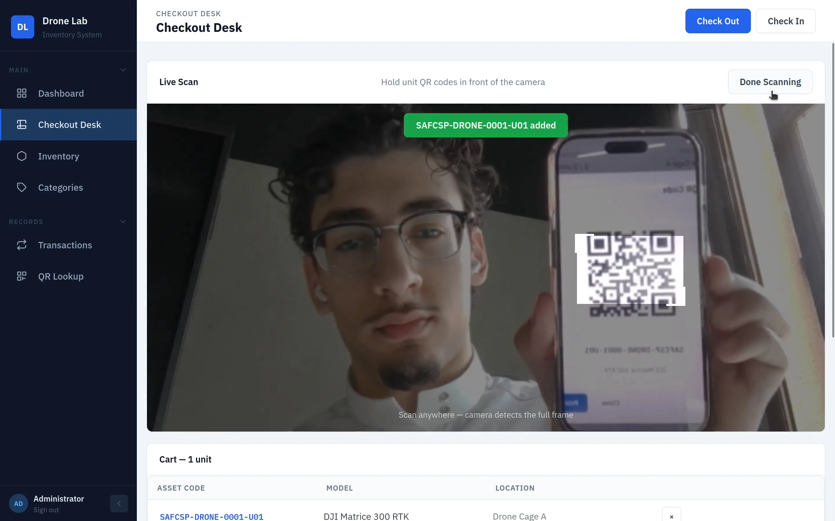 Live camera scan adding a unit to the checkout cart by reading its QR code from a phone screen